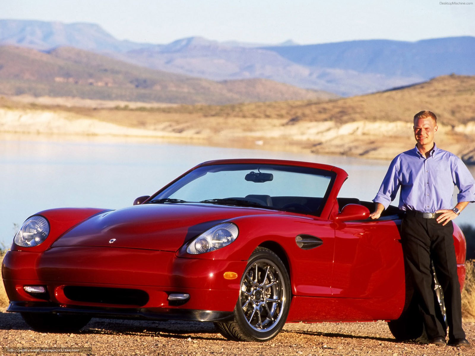 Man with red sports car