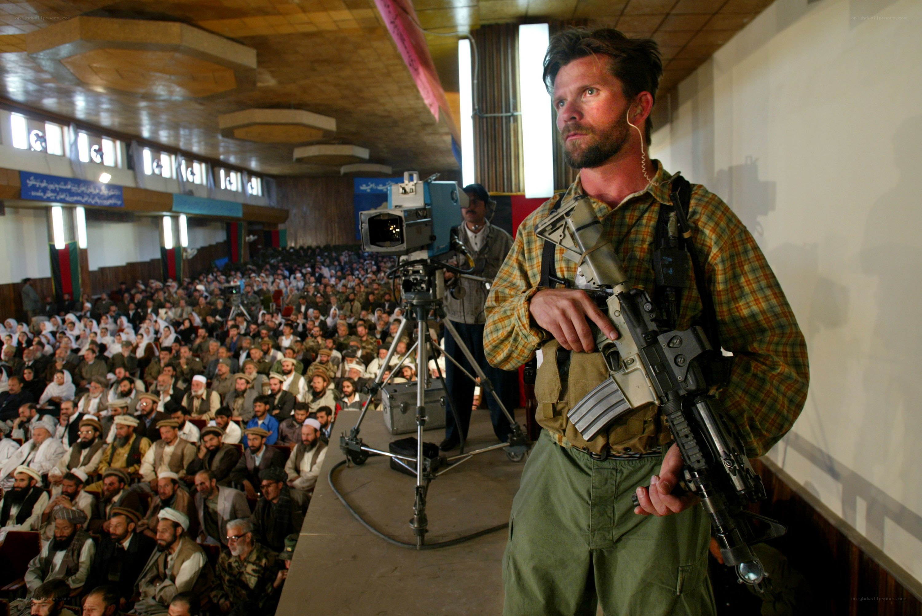 Man with rifle at public event
