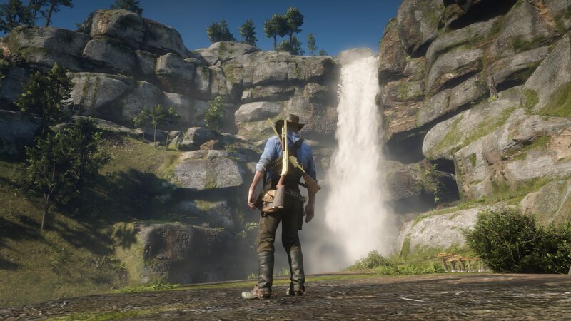 Man with Rifle at Waterfall