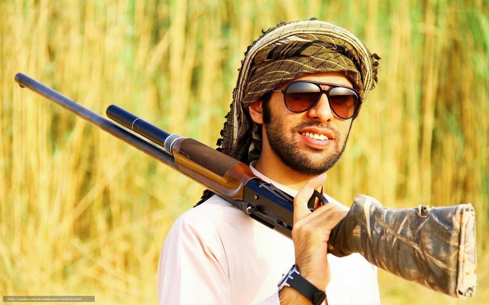man with rifle in field