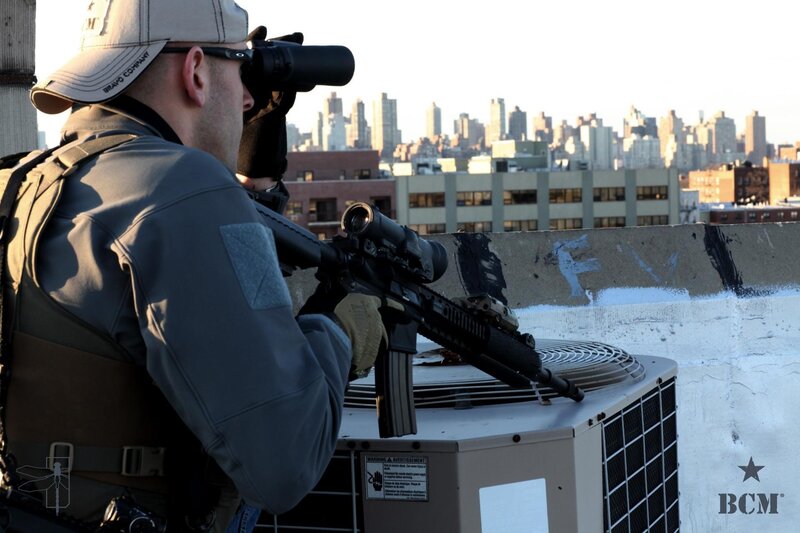 Man with Rifle on Rooftop — Gray