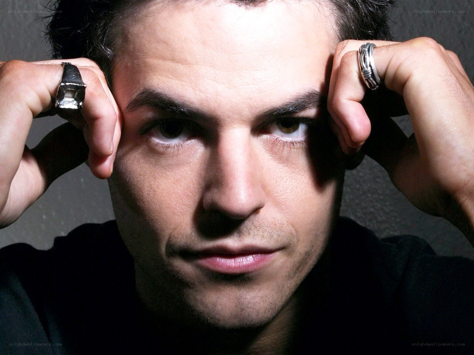 man with rings on fingers