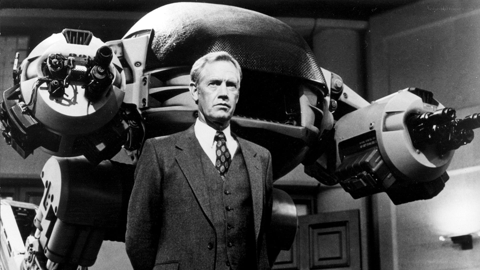 Man with robot behind him