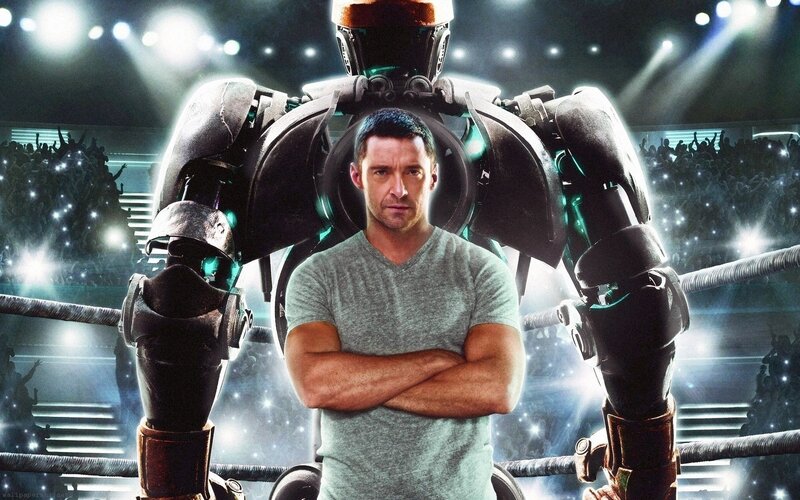 man with robot in boxing ring