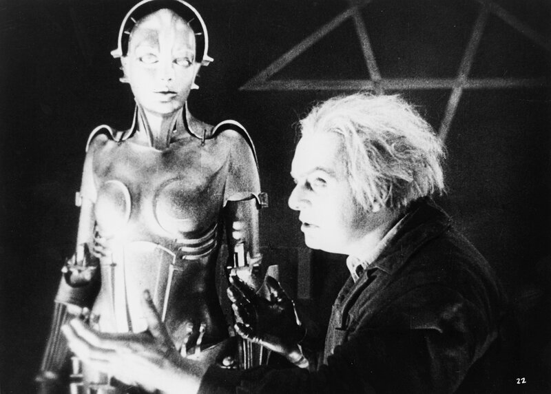 Man with robot in lab