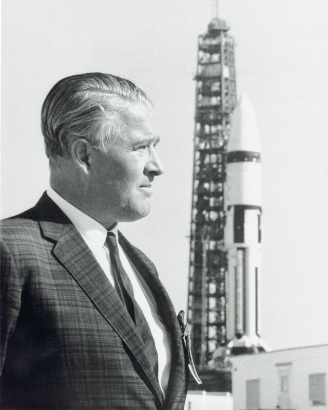 Man with rocket in background