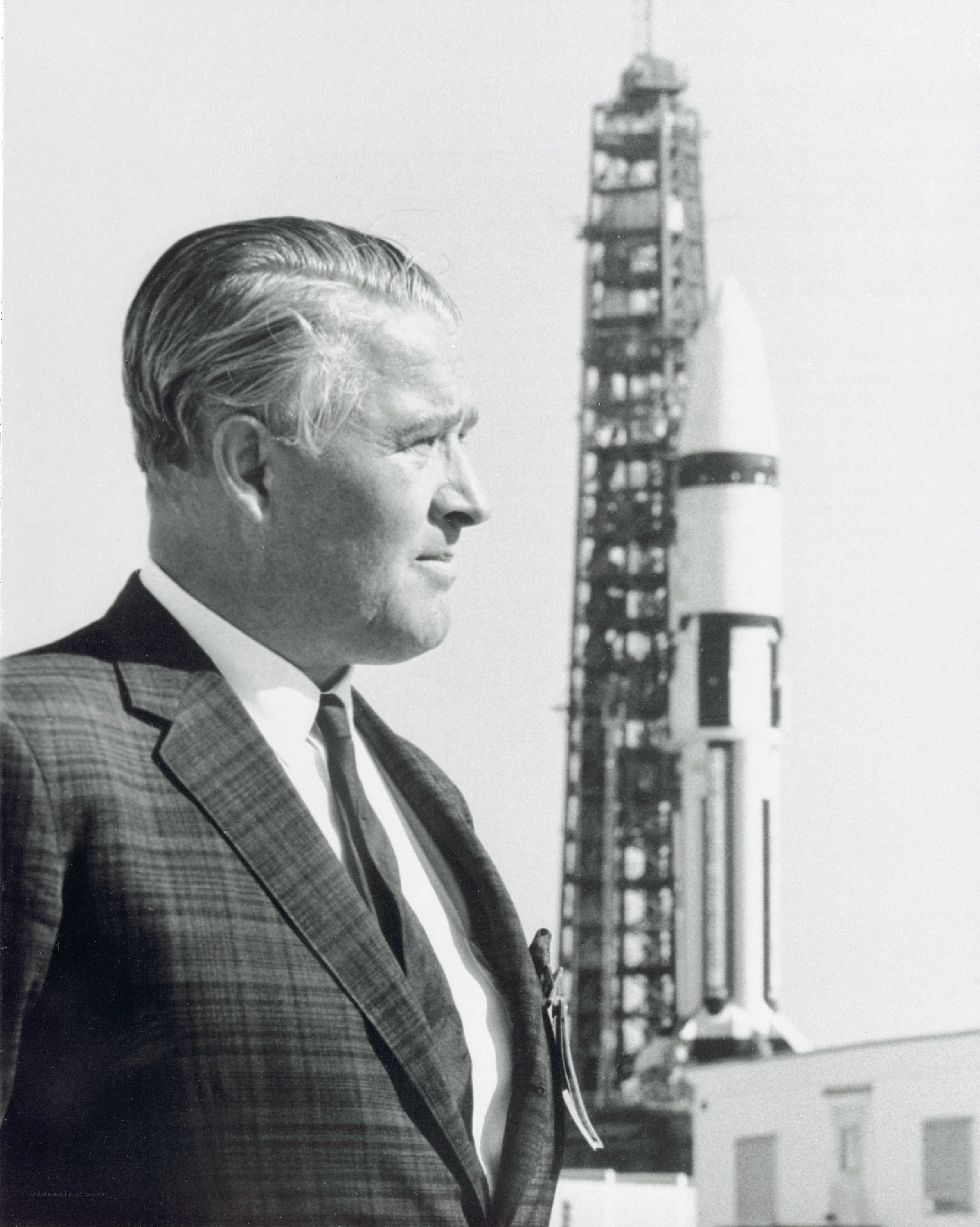 Man with rocket in background