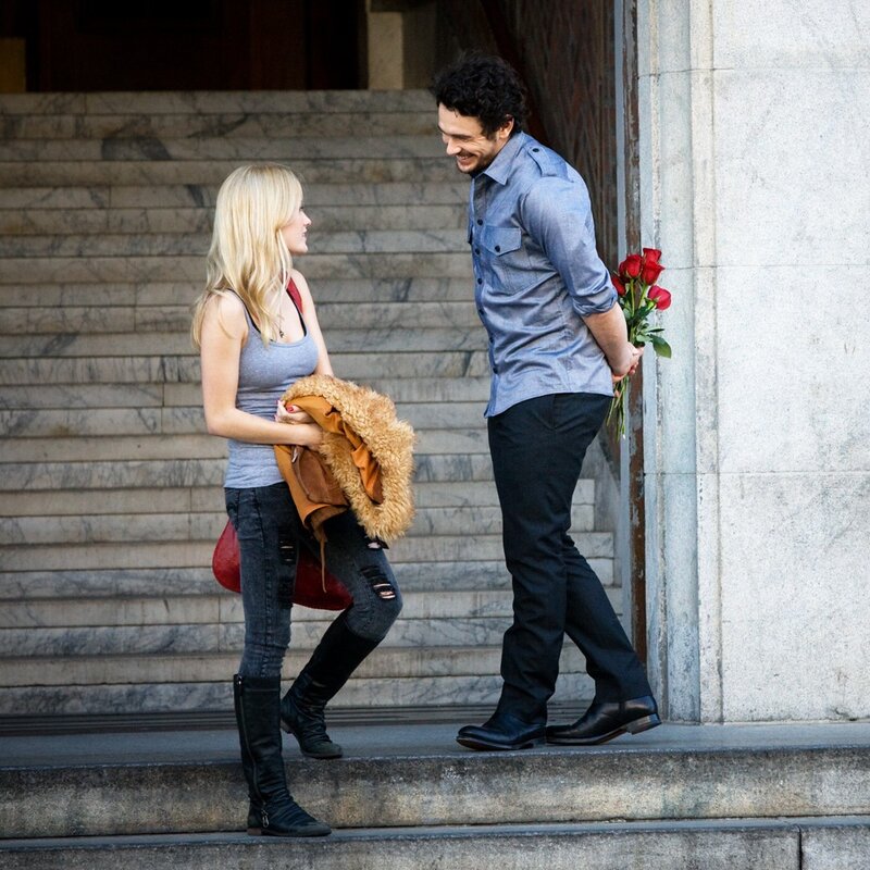 Man with roses meeting woman