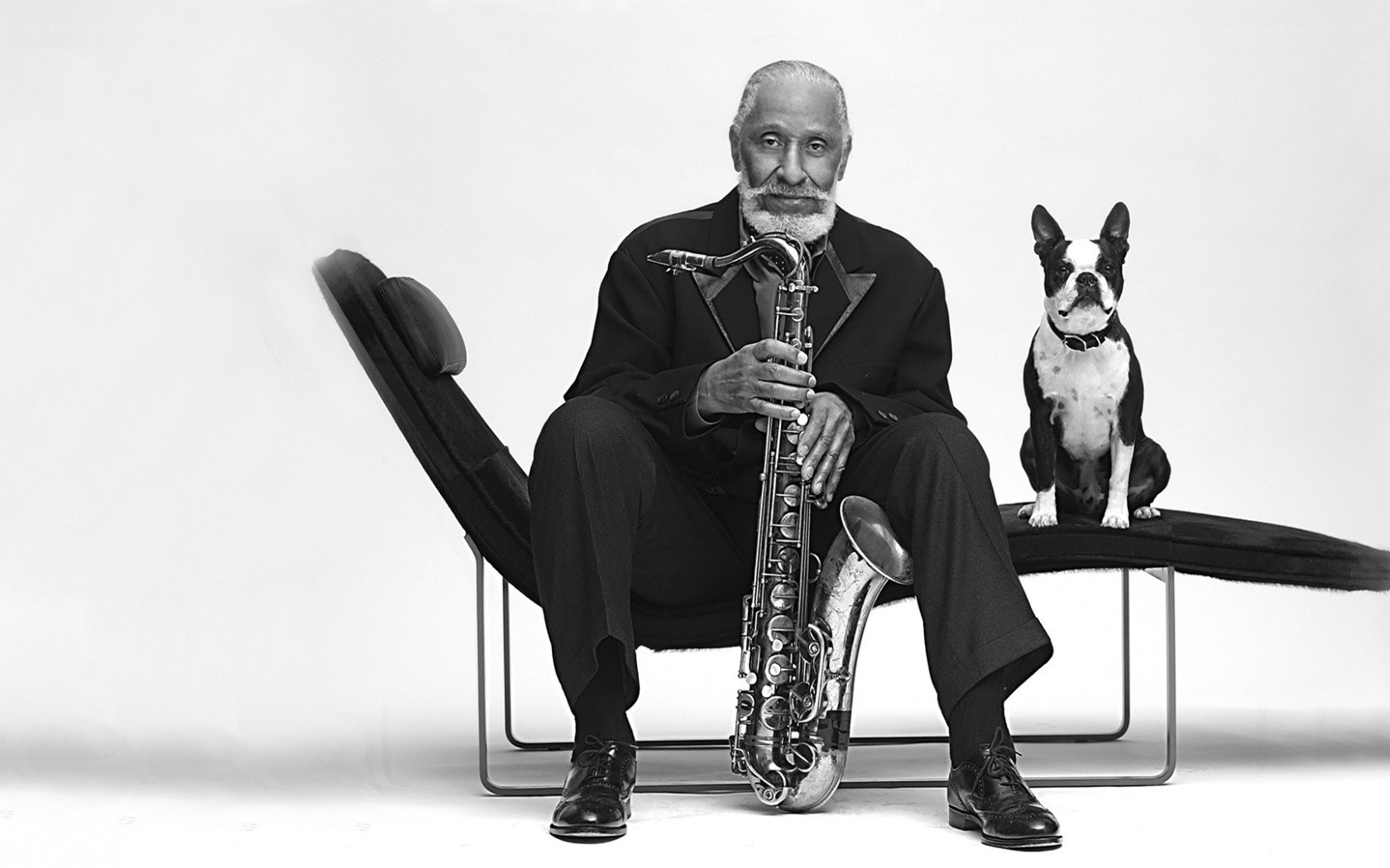 Man with saxophone and dog