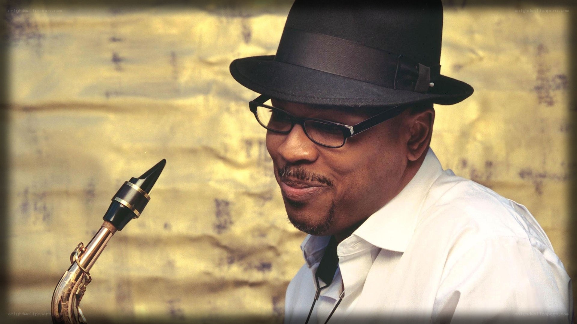 Man with saxophone and hat