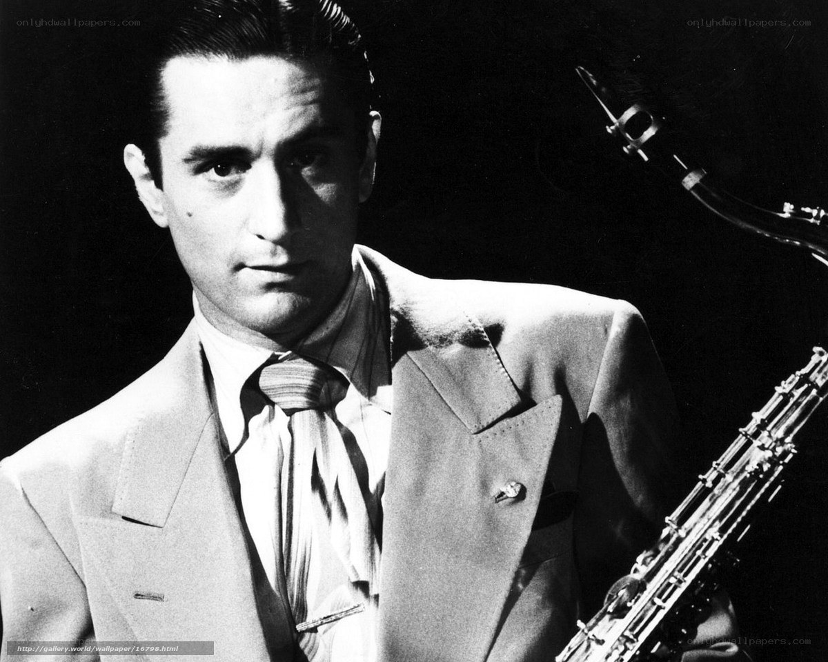 man with saxophone in suit