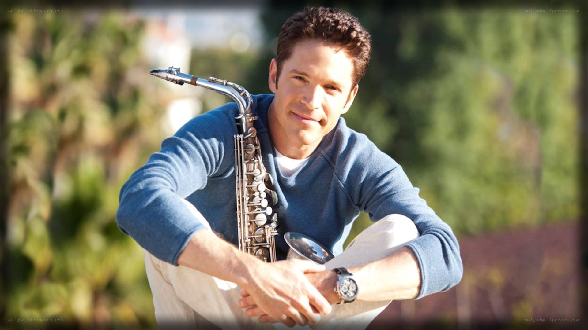 man with saxophone outdoors
