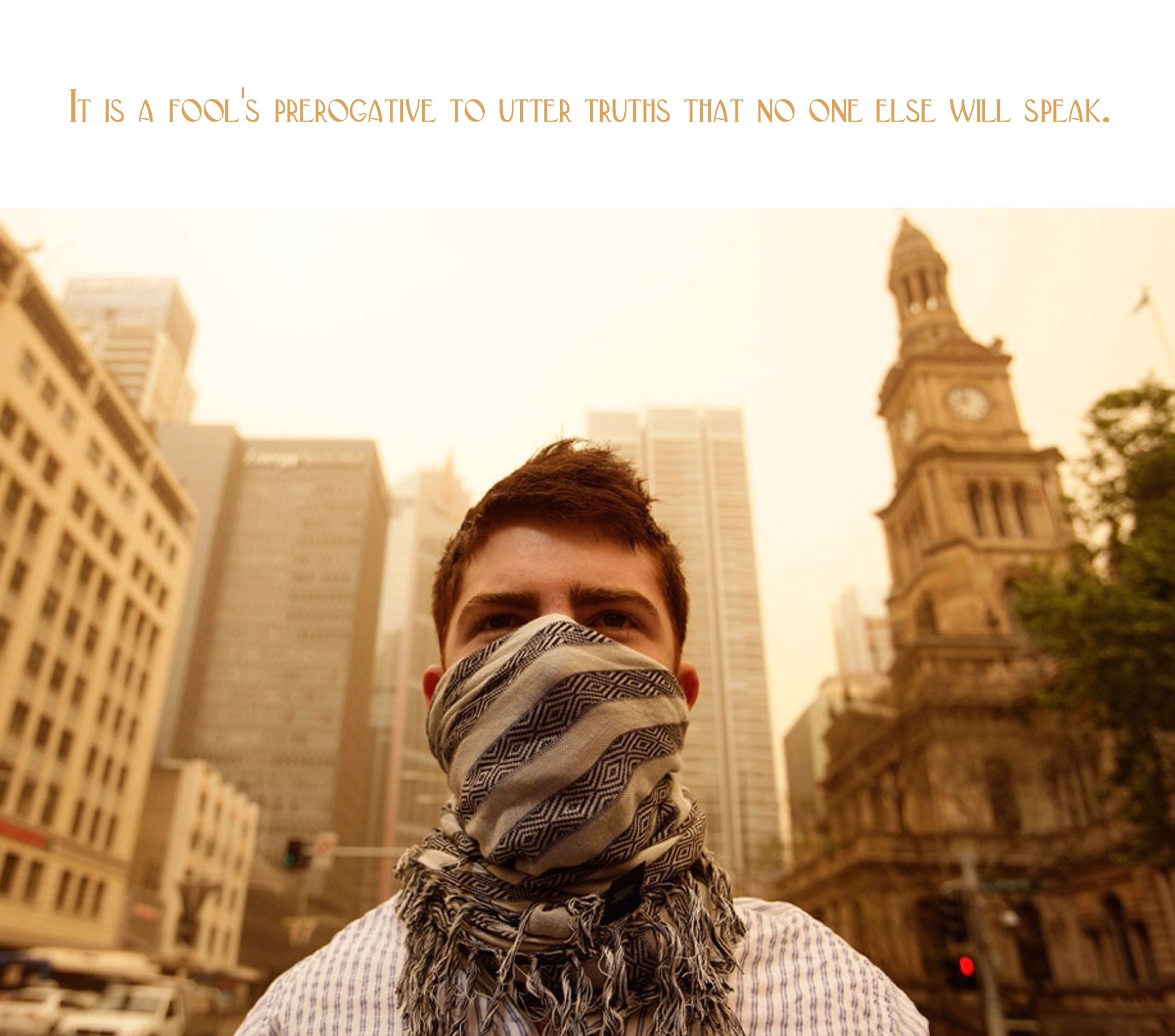 man with scarf in city