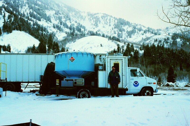 Man with scientific truck in snow