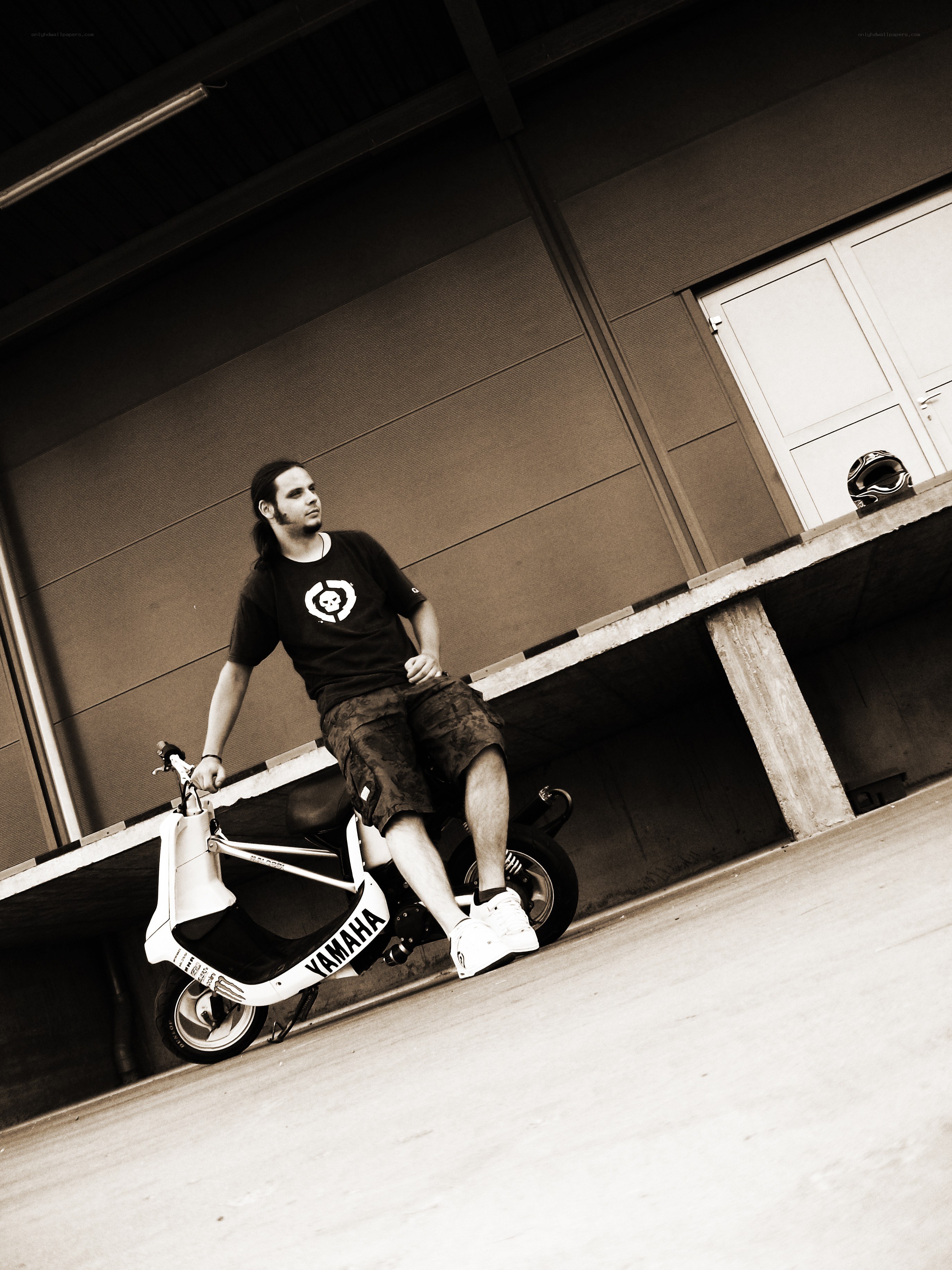 man with scooter in garage