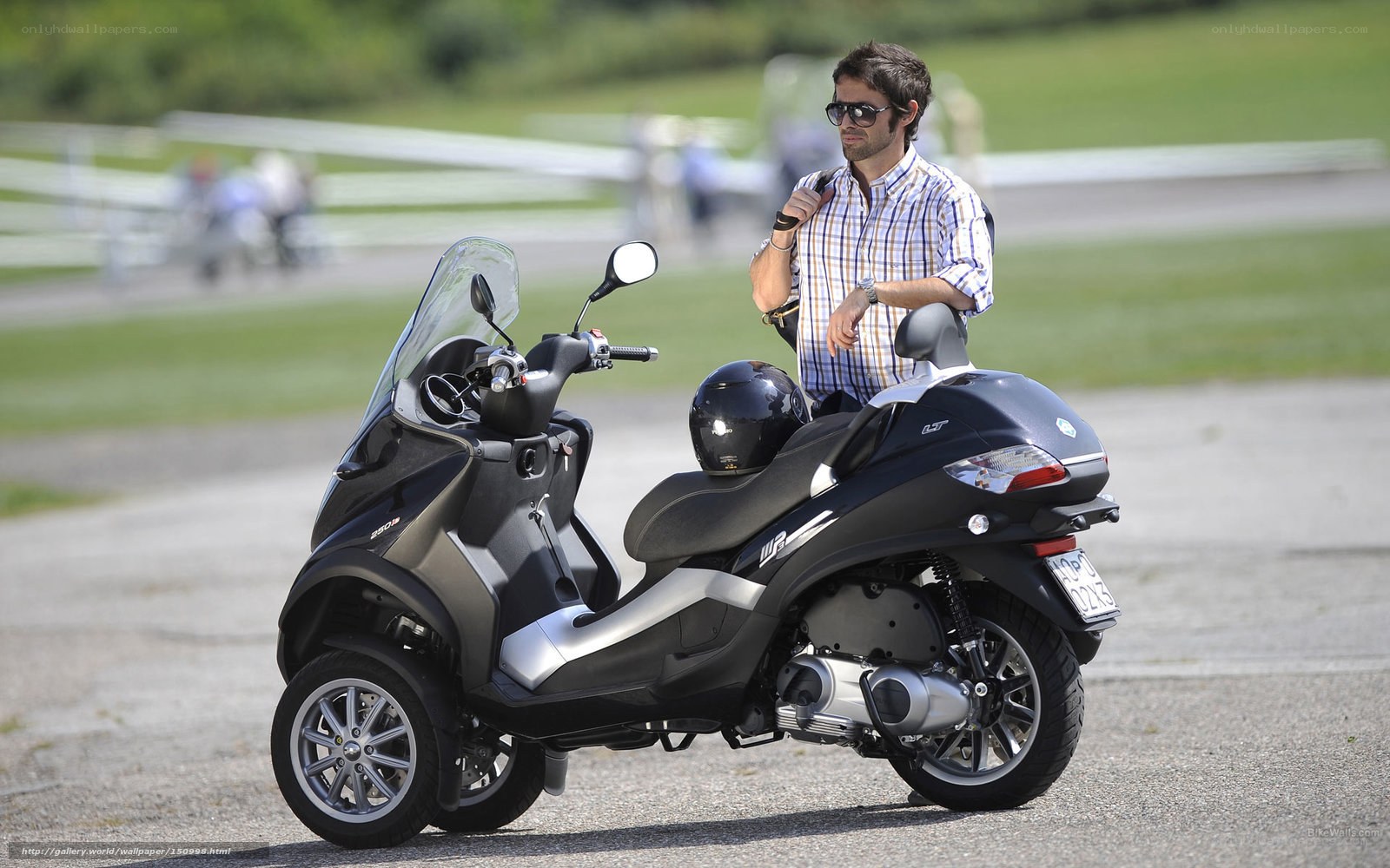 Man with scooter on track