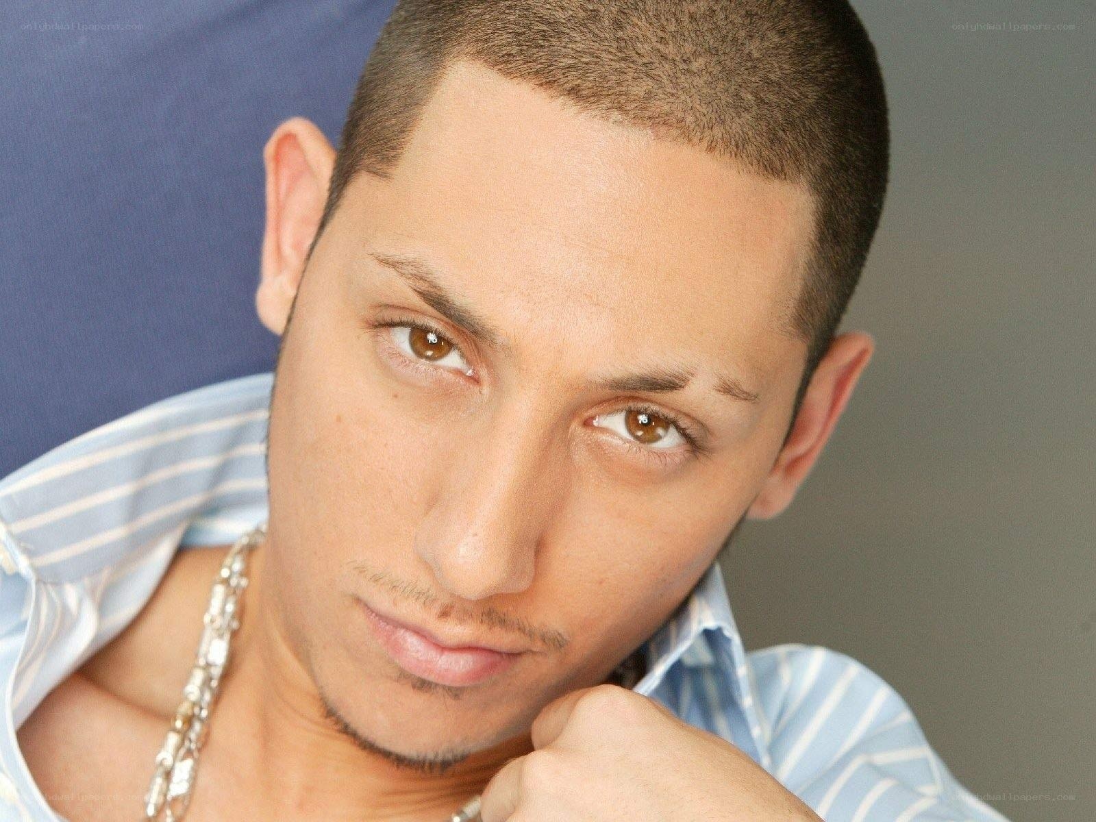 man with short hair looking at camera