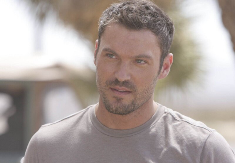 man with short hair looking away