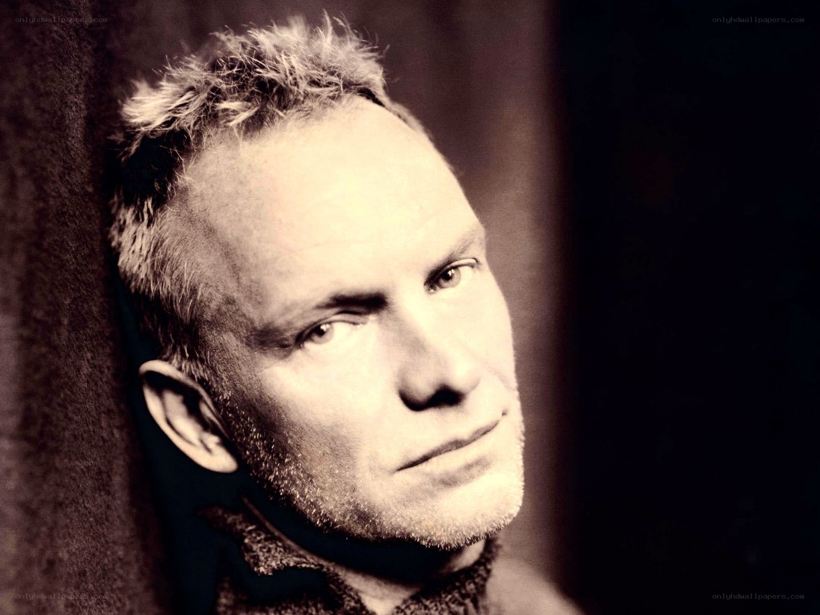 man with short hair looking away