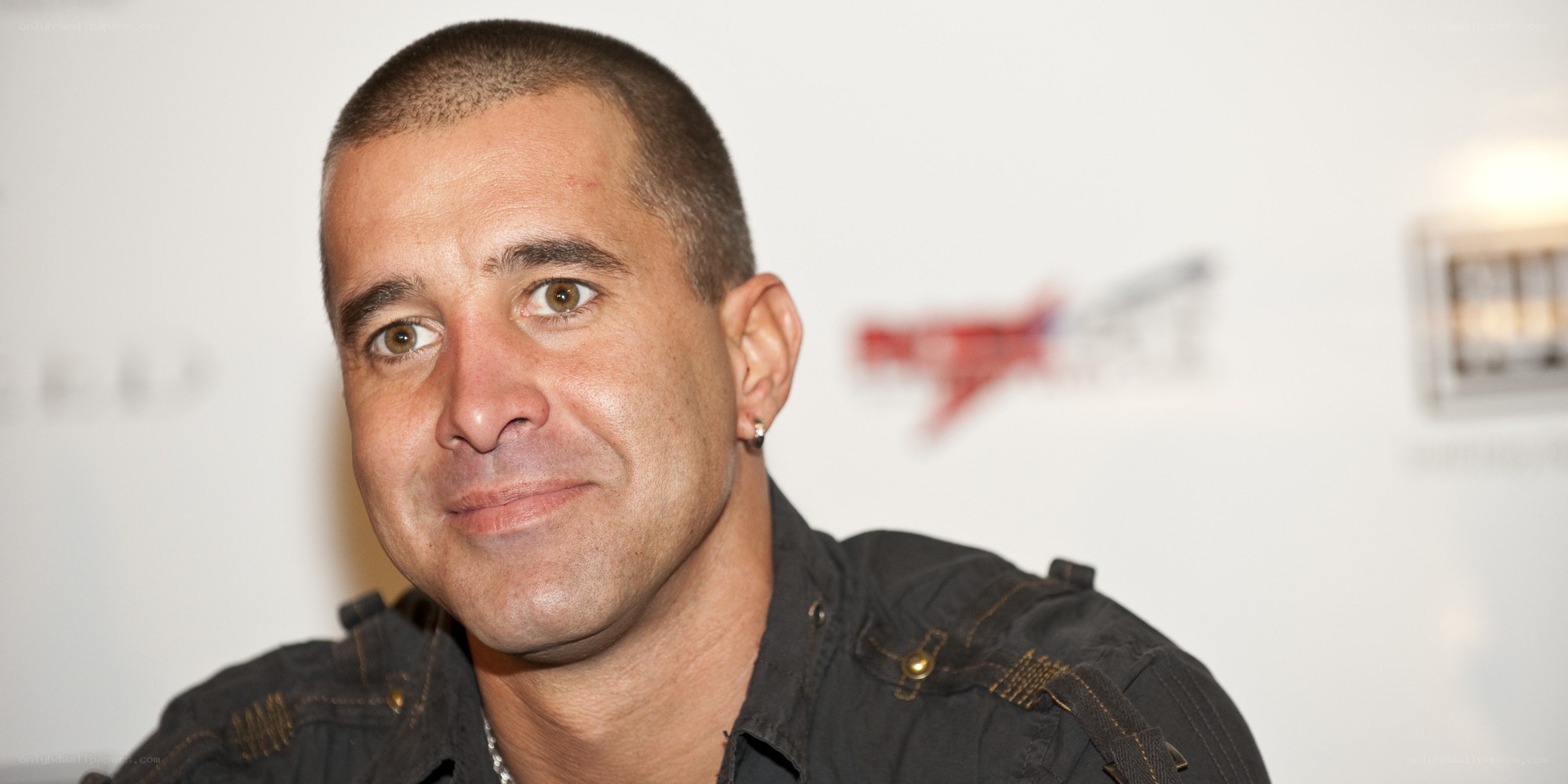 man with short hair smiling