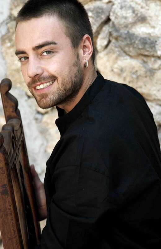 man with short hair smiling