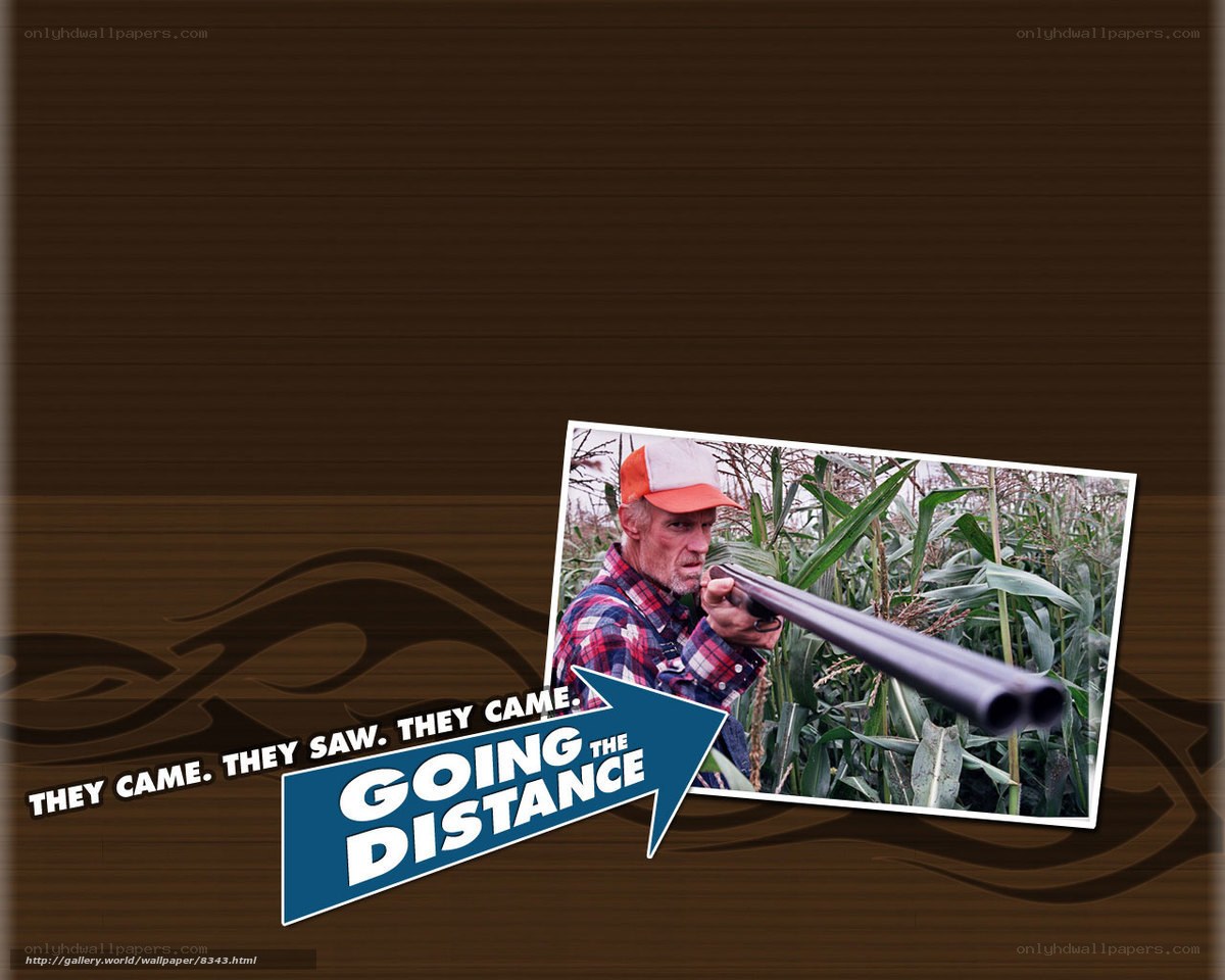 Man with shotgun in cornfield