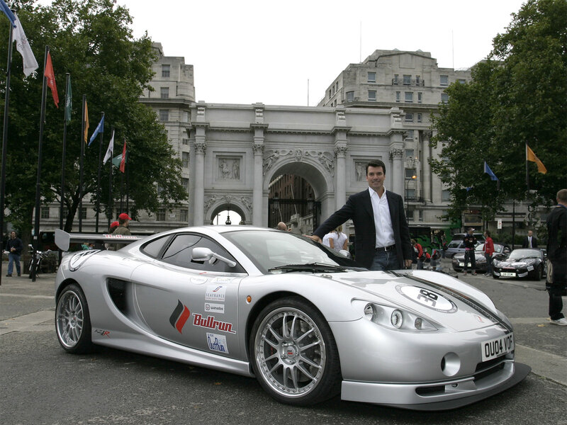 Man with silver sports car