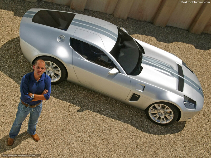 Man with silver sports car