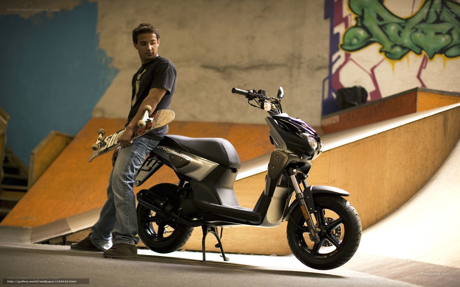 Man with skateboard and scooter