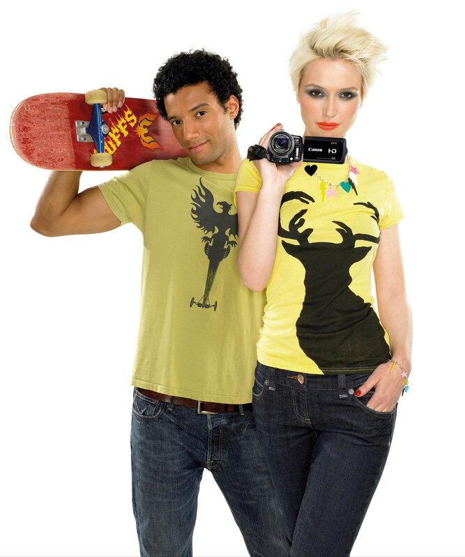 Man with skateboard and woman with camera