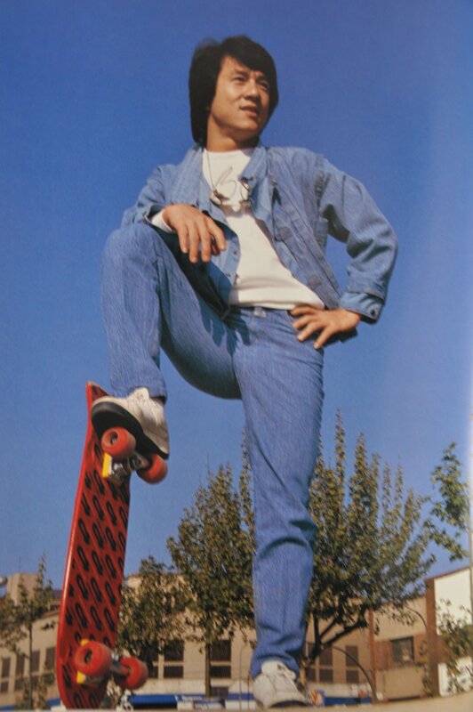 Man with skateboard in jeans