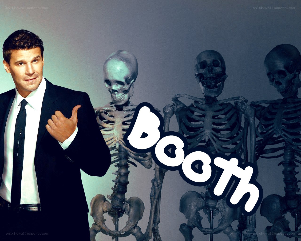man with skeletons in the booth