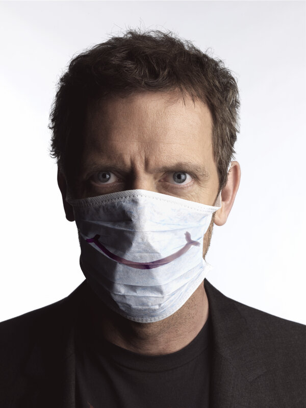 Man with smiley face mask