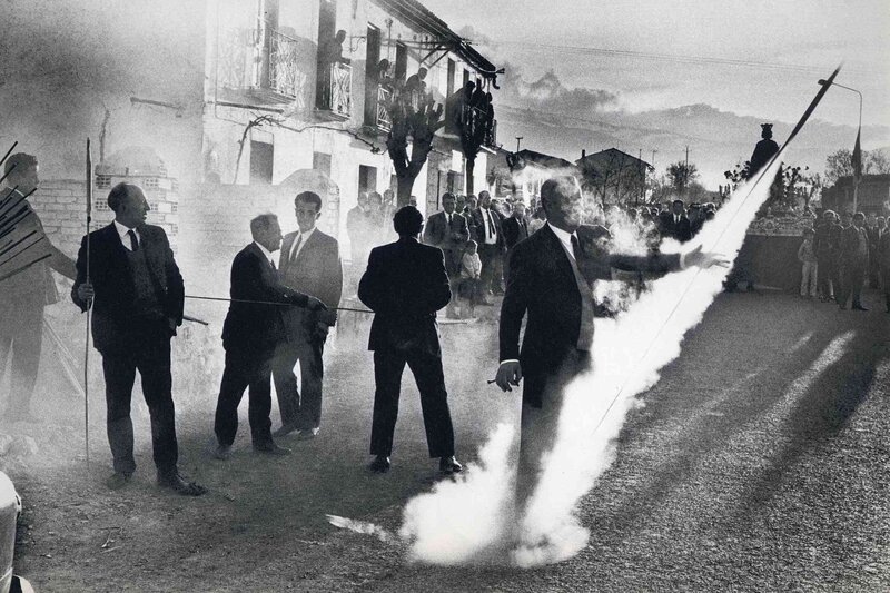 Man with smoke bomb in street
