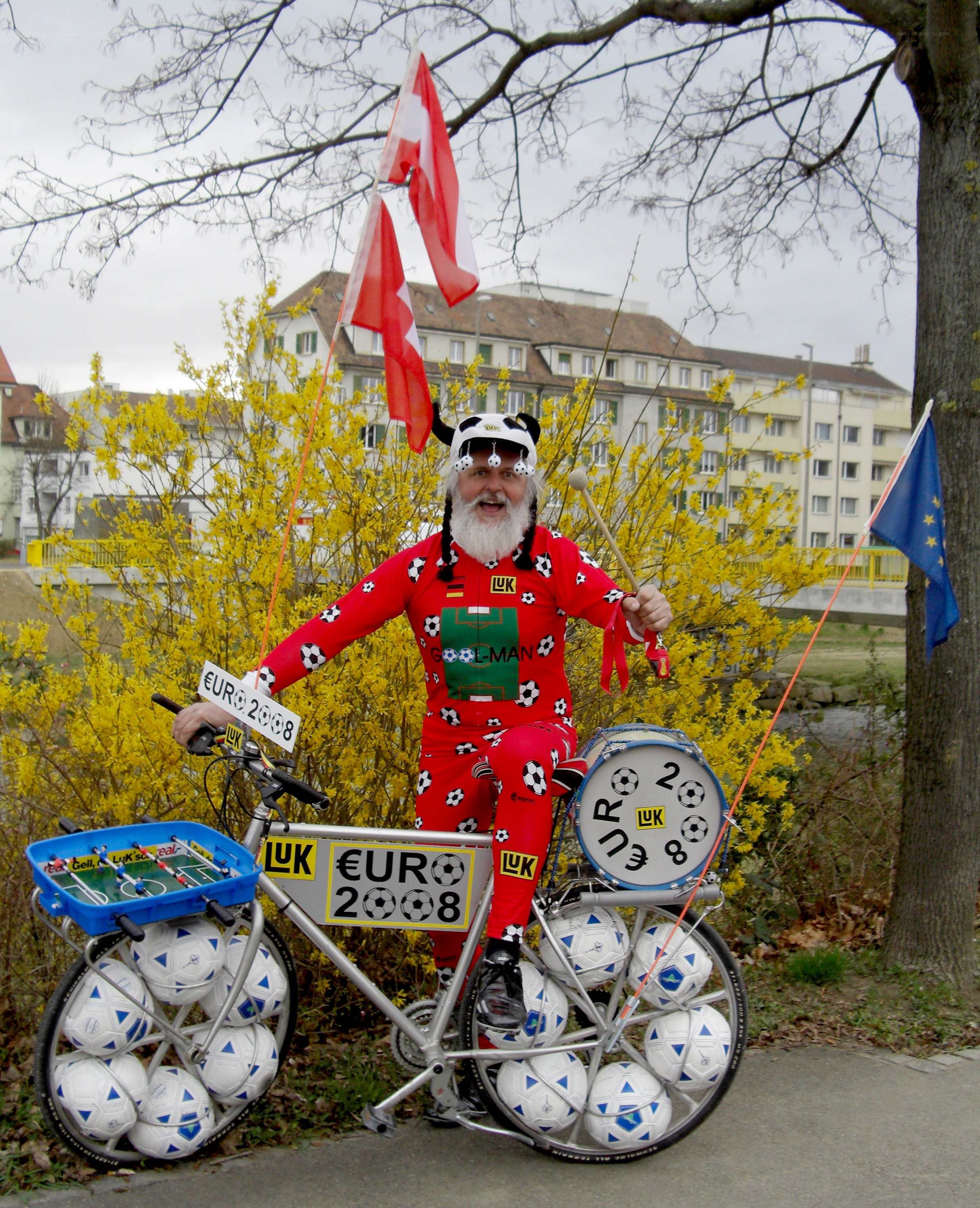 Man with soccer-themed bicycle
