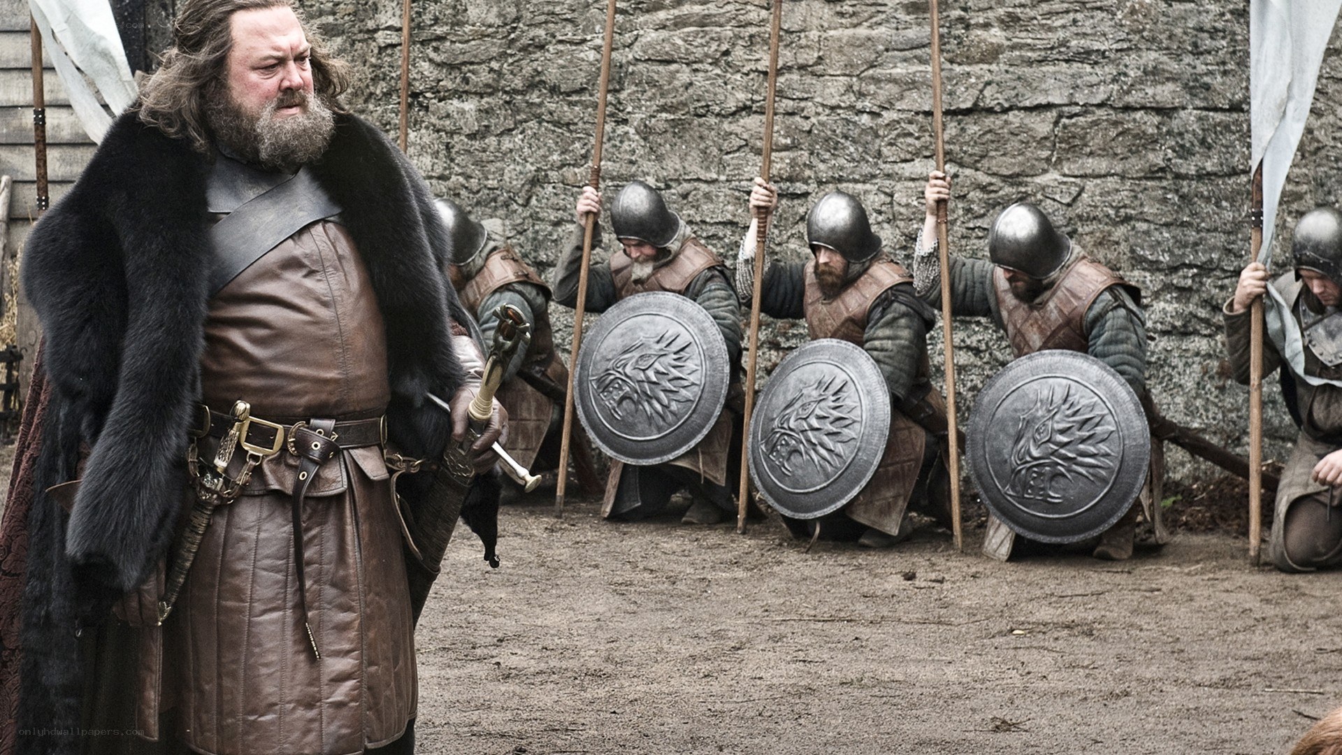 Man with soldiers in medieval setting