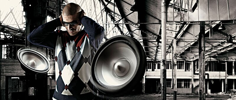 man with speakers in warehouse