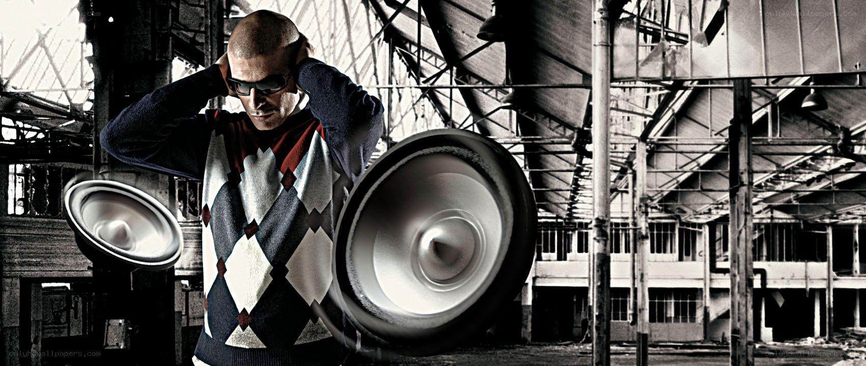 man with speakers in warehouse