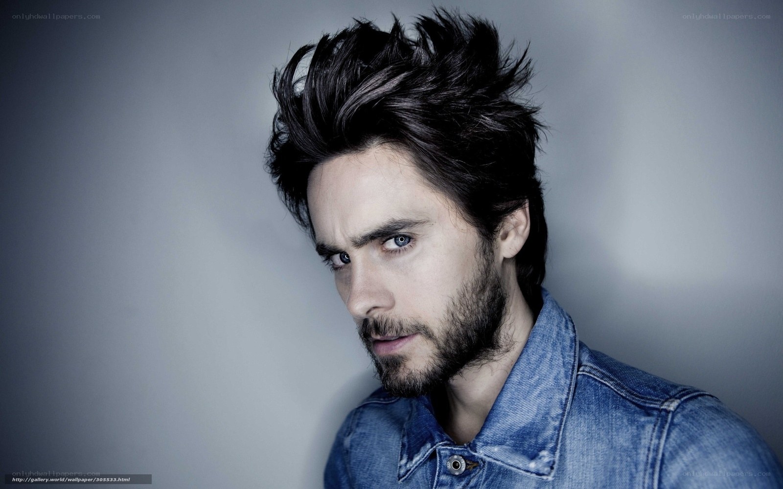 man with spiky hair and denim jacket
