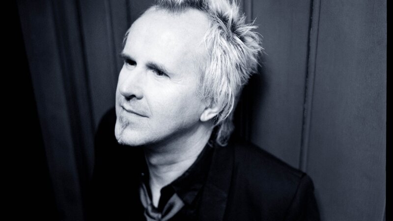 man with spiky hair in black and white