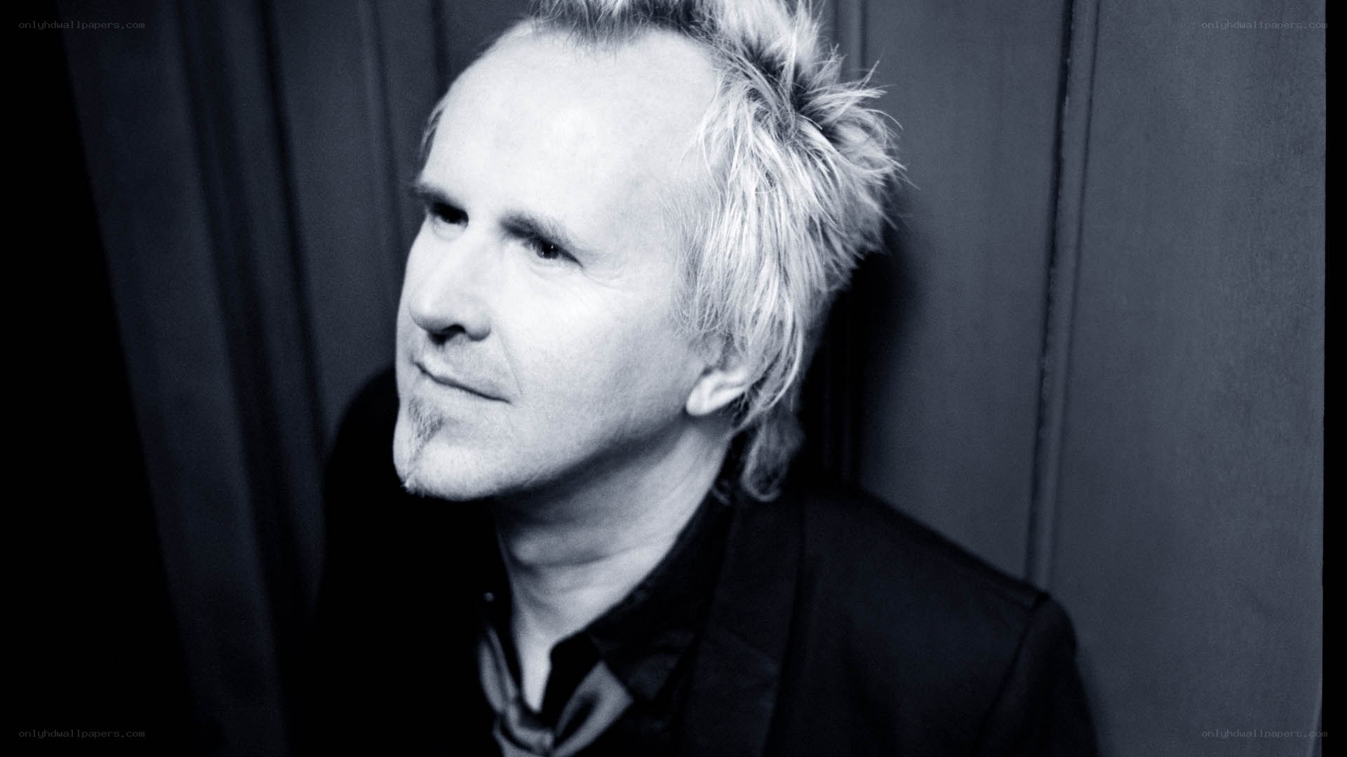 man with spiky hair in black and white