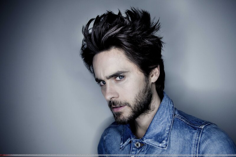 man with spiky hair in denim jacket