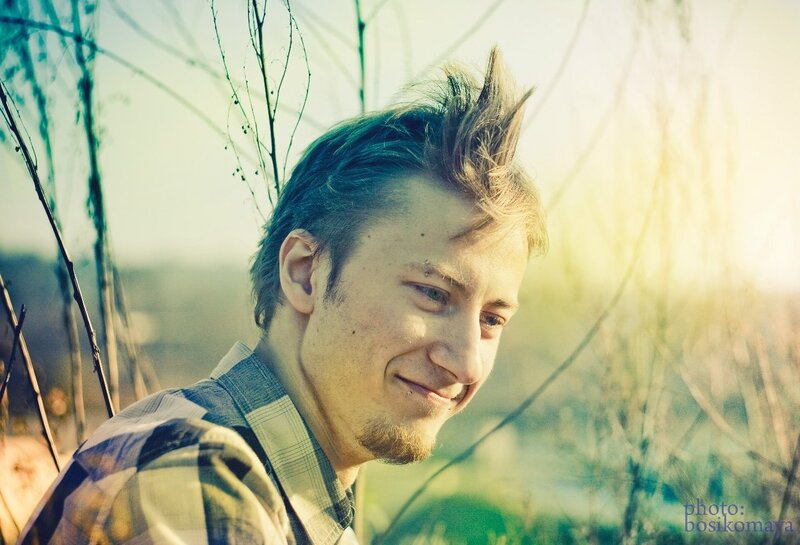 man with spiky hair in sunlight