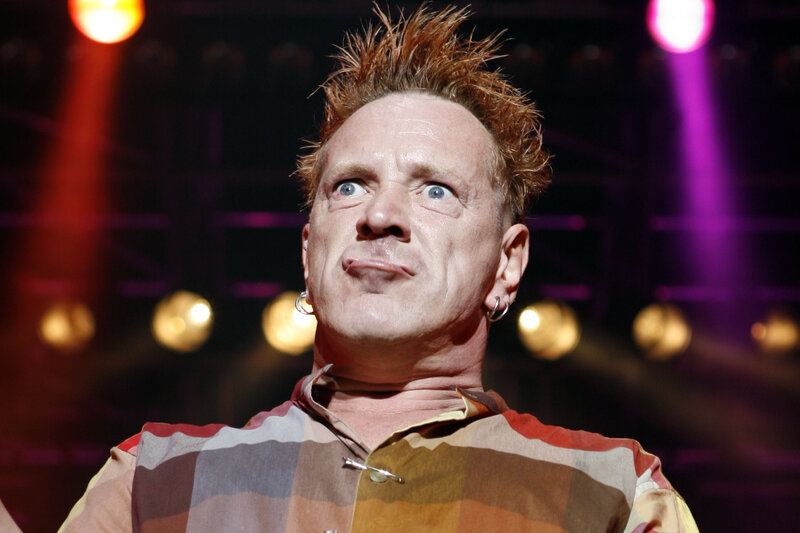 man with spiky hair on stage