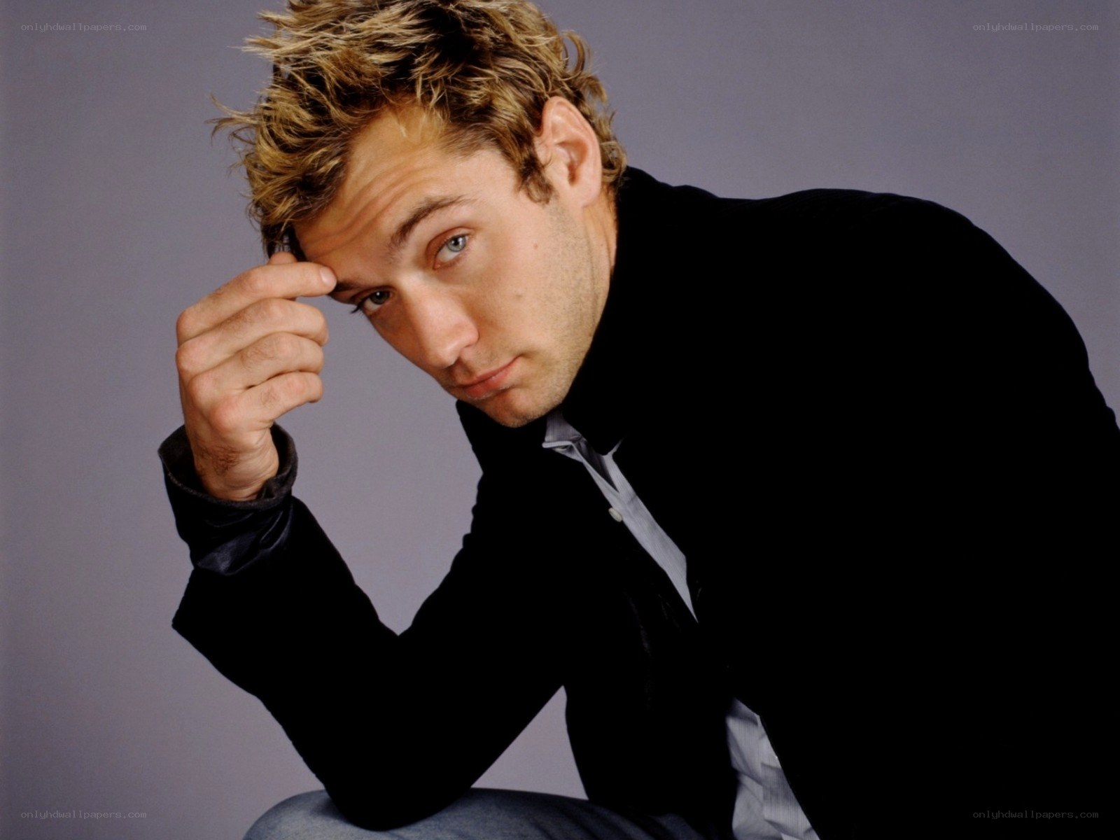 man with spiky hair posing