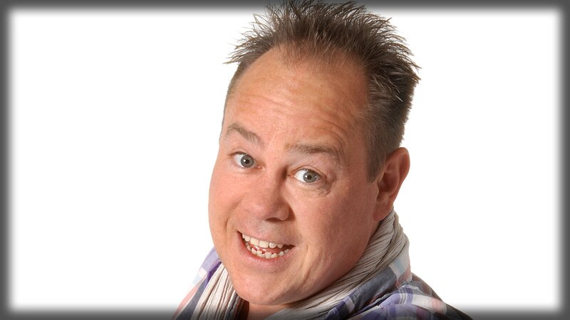 man with spiky hair smiling
