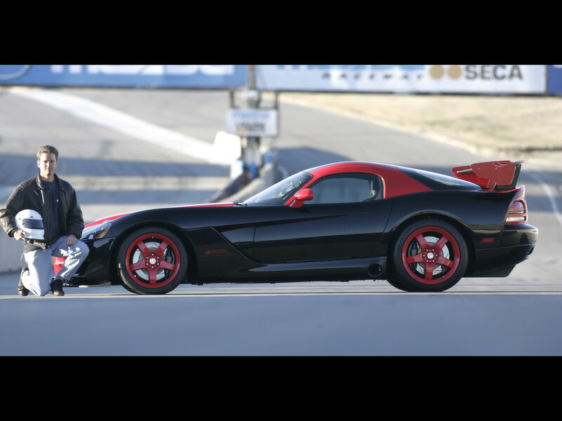 Man with sports car on racetrack