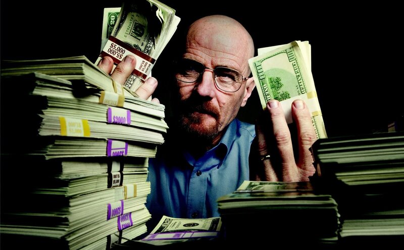 man with stacks of cash