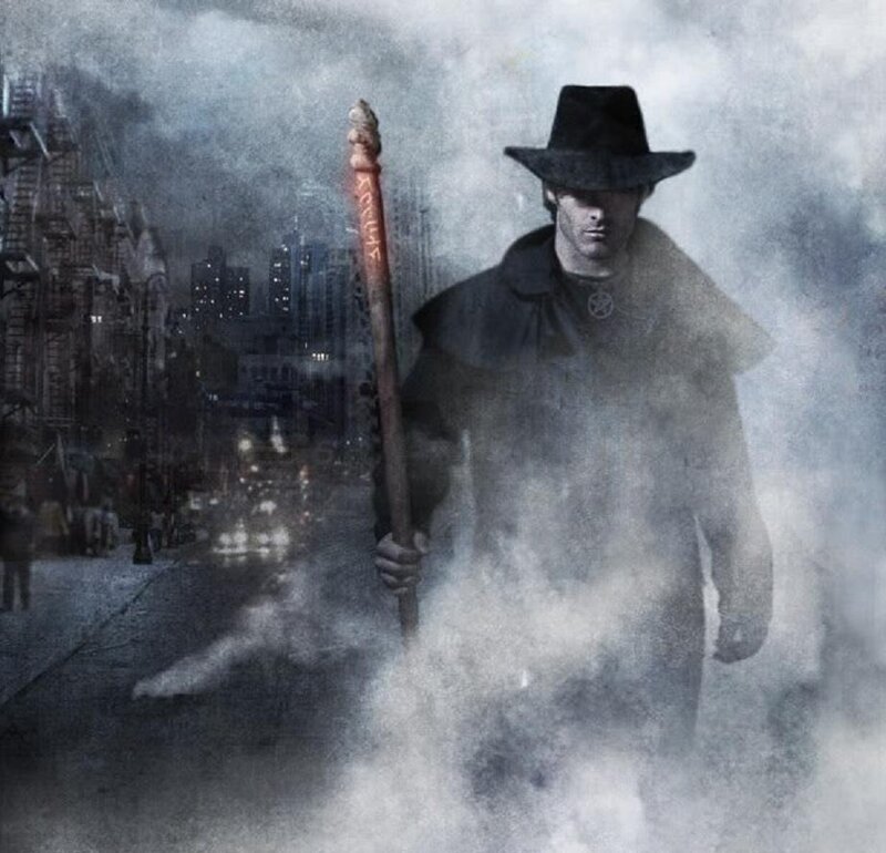 man with staff in foggy city