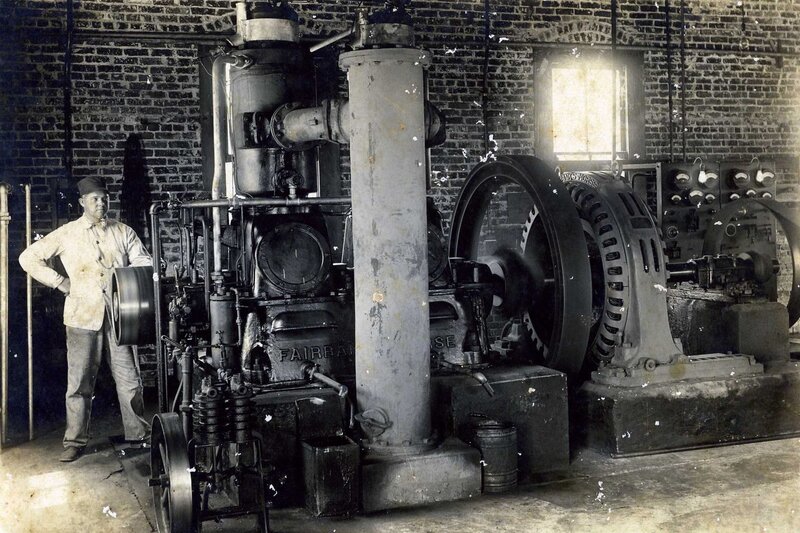 Man with steam engine in factory